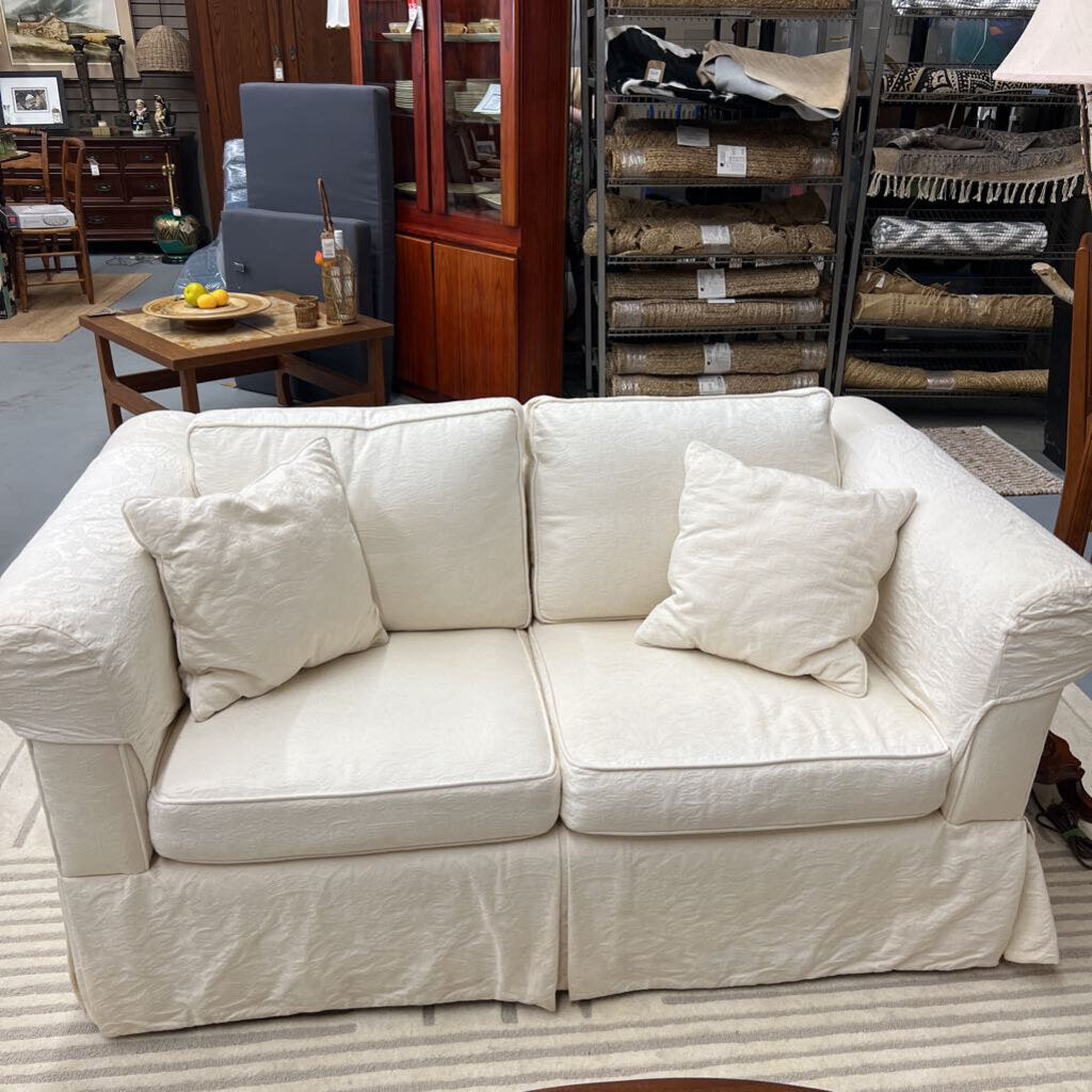 White Love Seat with Slip Covers