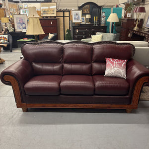 Oxblood Red Rolled Arm Leather Sofa w Brass Nail Trim & Carved Wood Detail