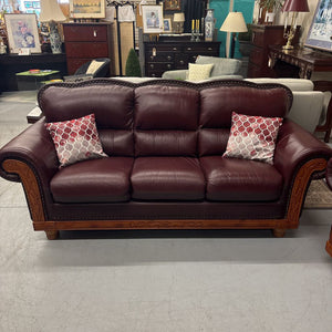 Oxblood Red Rolled Arm Leather Sofa w Brass Nail Trim & Carved Wood Detail